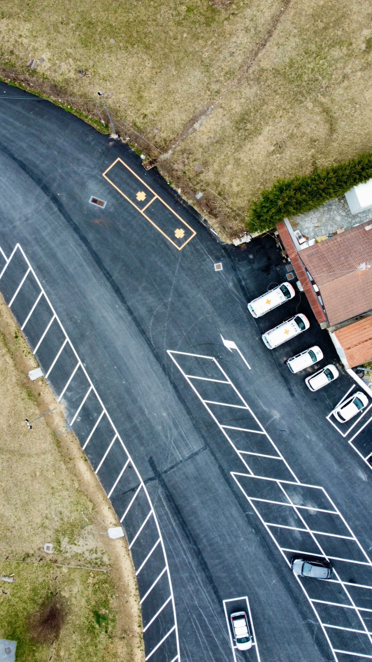 Aerial view of a paved commercial parking lot